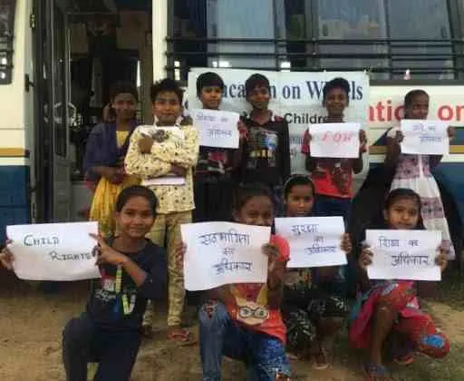 Education on Wheels customized bus exterior in community setting
